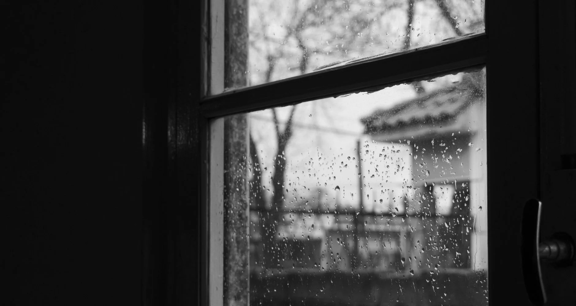 Heavy rain storm hitting a window