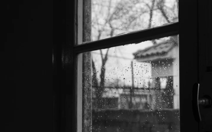 Heavy rain storm hitting a window