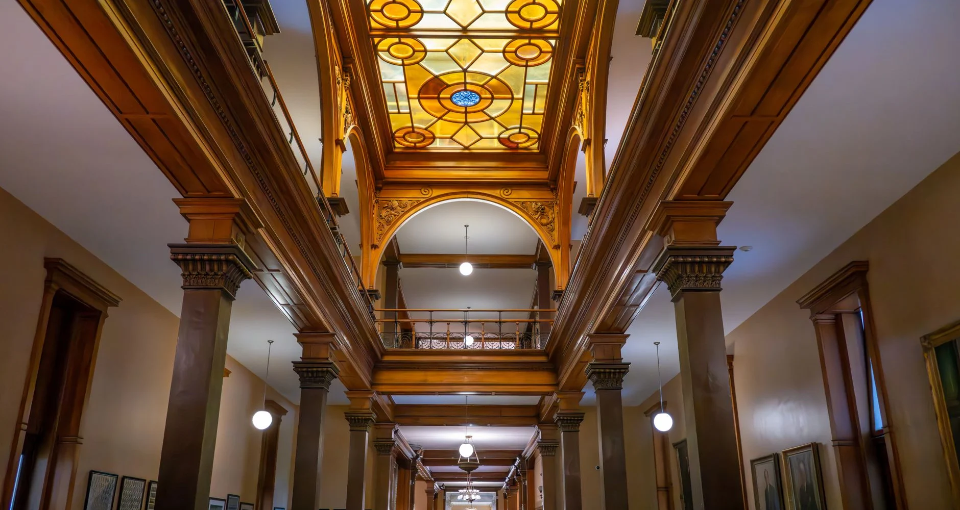 Interior of a historic building with stained glass and architectural details