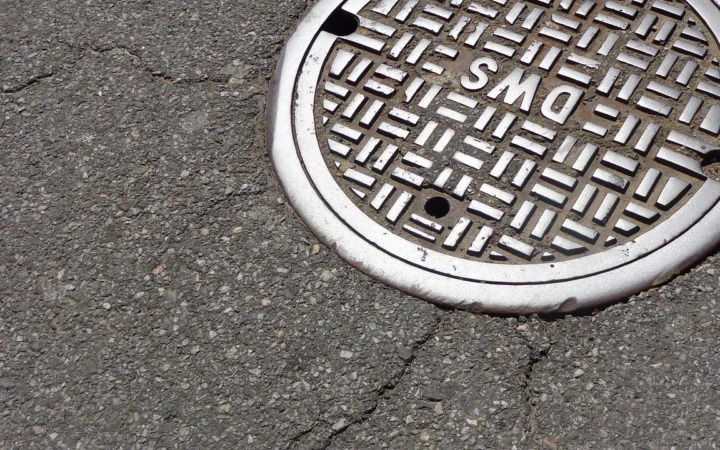 Sewer manhole cover on a city street